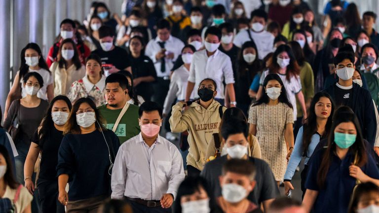 People wearing face mask amid poor air pollution in the Thai capital.
Pic: Reuters/Athit Perawongmetha