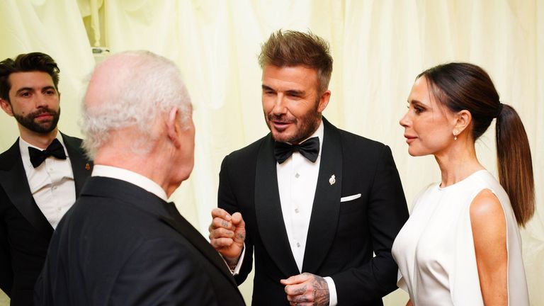 The King speaks to David and Victoria Beckham at Highgrove House, Tetbury, Gloucestershire. Pic: PA