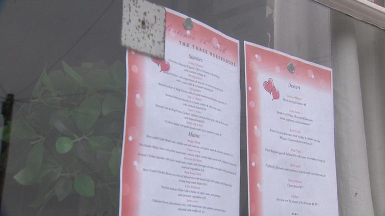 The Valentine's Day menu is still visible in the pub's window