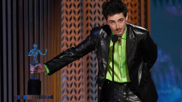 Timothee Chalamet accepts the award for outstanding performance by a male actor in a leading role for "A Complete Unknown" during the 31st annual Screen Actors Guild Awards on Sunday, Feb. 23, 2025, at the Shrine Auditorium in Los Angeles. (AP Photo/Chris Pizzello)