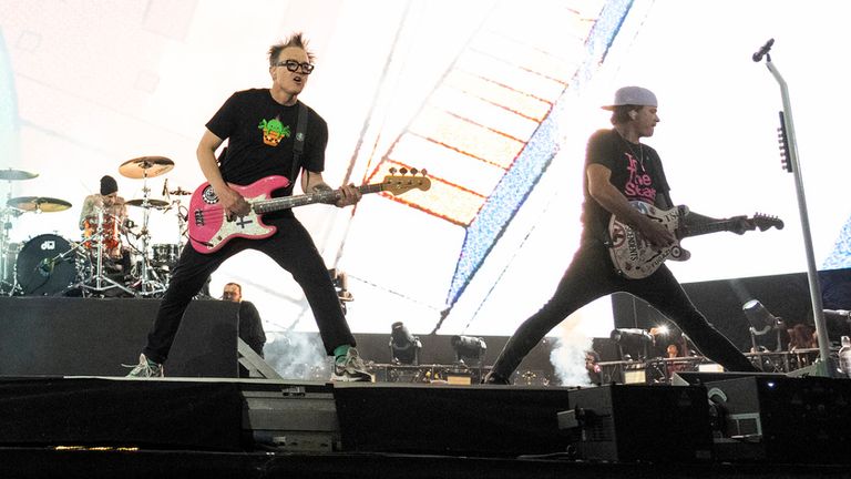 Travis Barker, left, Mark Hoppus, and Tom DeLonge of Blink-182 on stage at the Coachella festival in California in 2023. Pic: Amy Harris/Invision/AP