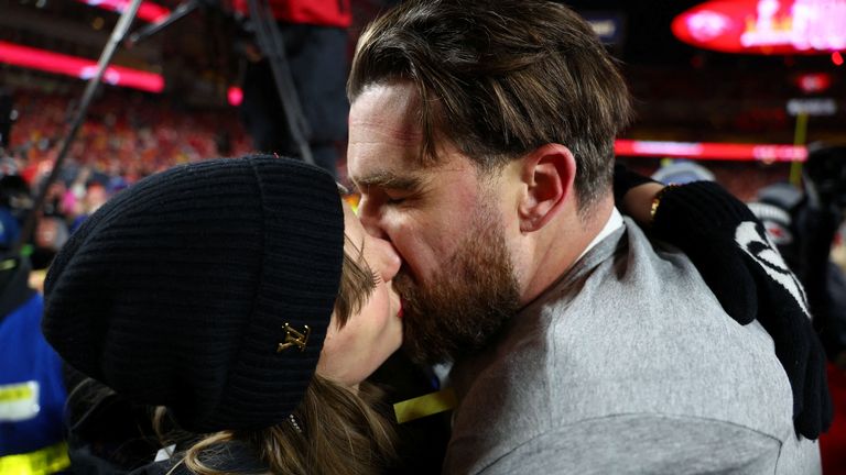 Jan 26, 2025; Kansas City, MO, USA; Recording artist Taylor Swift and Kansas City Chiefs tight end Travis Kelce (87) react after the AFC Championship game against the Buffalo Bills at GEHA Field at Arrowhead Stadium. Mandatory Credit: Mark J. Rebilas-Imagn Images