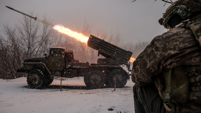 Ukrainian troops fire rockets towards a Russian position