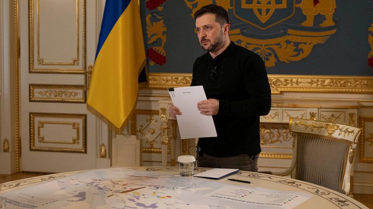 Volodymyr Zelenskyy with the 'Plan of Victory' map. Pic: Reuters