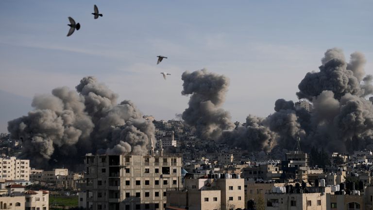 Smoke rises from buildings destroyed by the Israeli military.
Pic: AP/Majdi Mohammed