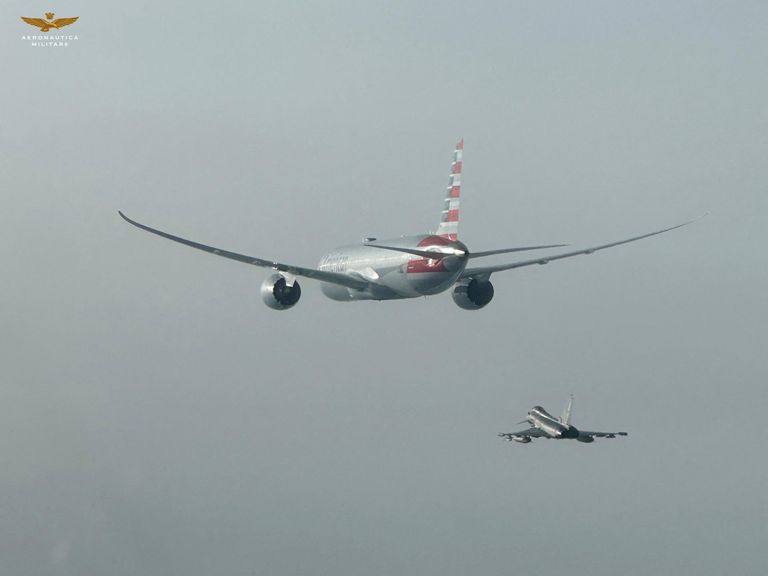 An Italian Air Force Eurofighter aircraft escorts an American Airlines plane in this handout photo obtained by Reuters on February 23, 2025. Italian Air Force/Handout via REUTERS THIS IMAGE HAS BEEN SUPPLIED BY A THIRD PARTY