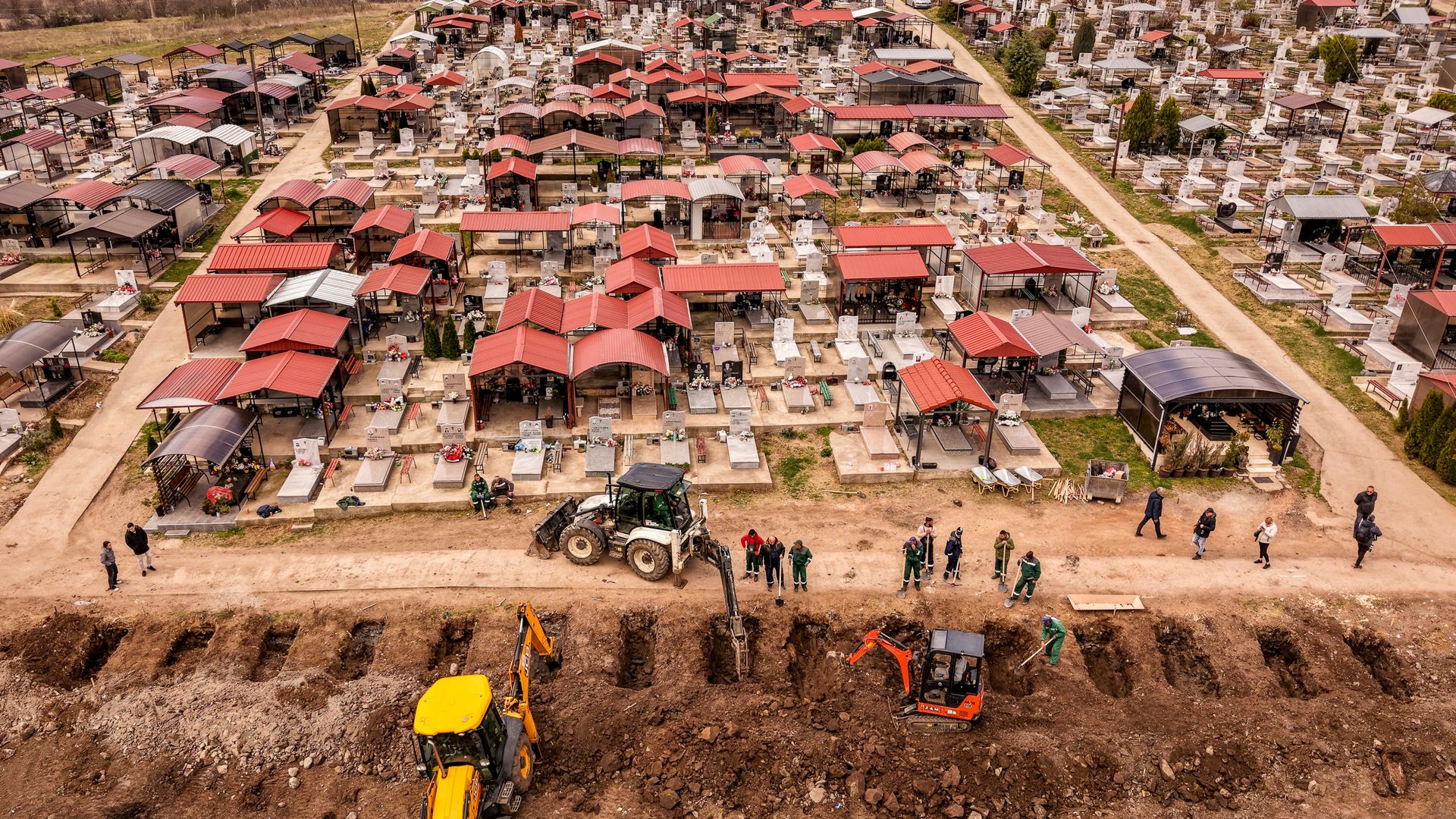 Line of graves dug for nightclub victims in North Macedonia - as thousands demand justice