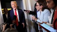 Donald Trump speaks to reporters aboard Air Force One. Pic: Reuters