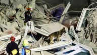 Rescuers work at the site of a Bangkok skyscraper under construction that collapsed after an earthquake. Pic: AP