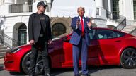 Elon Musk and Donald Trump in front of a Tesla at the White House. Pic: Reuters