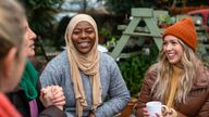 Volunteers sitting outdoors wearing warm casual clothing on a sunny cold winter's day. File pic: iStock