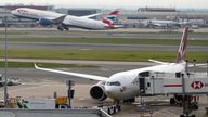 A British Airways plane takes off as Heathrow Airport slowly resumes flights after a fire cut power to Europe's busiest airport in London. Pic: AP