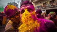 People apply color powder on each other as they celebrate Holi festival in Guwahati, India, Friday, March 14, 2025. (AP Photo/Anupam Nath)