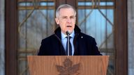 Prime Minister Mark Carney speaks to media at Rideau Hall, where he asked the Governor General to dissolve Parliament and call an election, in Ottawa, Sunday, March 23, 2025.  (Adrian Wyld/The Canadian Press via AP)