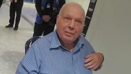 Richard Burrows steps off a plane at Heathrow to be met by police. Picture taken from Greg Milam package. Uploaded 12 March 2025. DO NOT USE WITHOUT LEGAL CHECK. PICTURE FOR VERDICT STORY.