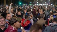 People observe 15 minutes of silence during a massive anti-government rally in Belgrade, Serbia, Saturday, March 15, 2025. (AP Photo/Marko Drobnjakovic)