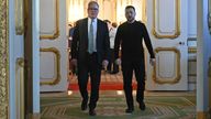 Ukraine's President Volodymyr Zelensky and Prime Minister Sir Keir Starmer head to a private room to hold a meeting during a Leaders' Summit on the situation in Ukraine at Lancaster House, London. Picture date: Sunday March 2, 2025.
