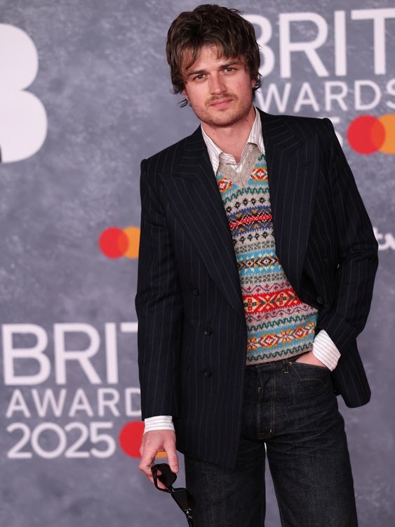 Rarely do you see a knitted tank top on the red carpet.  Joe Keery, aka Djo, hasn't let that put him off. Pic: Reuters