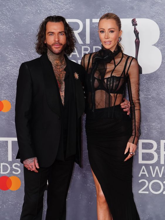 Reality stars Pete Wicks and Olivia Attwood, both keeping torso coverage to a bare minimum. Pic: PA