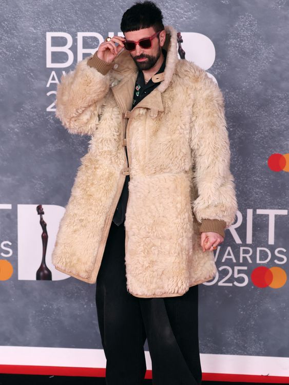 Kasabian star Serge Pizzorno, keeping out the cold. Pic: Reuters