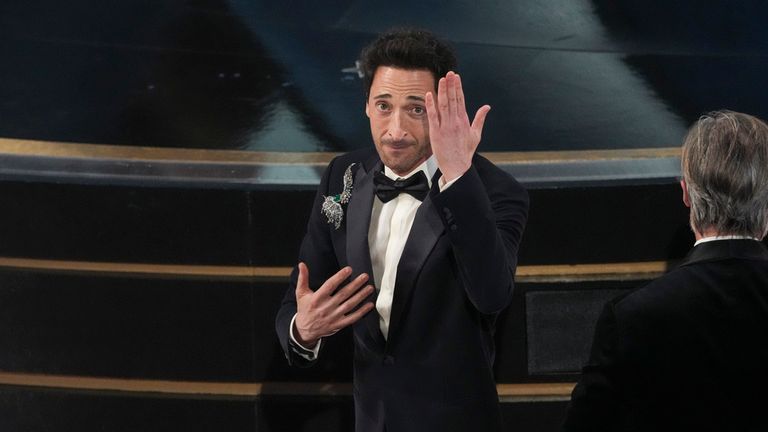 Adrien Brody accepts the award for best performance by an actor in a leading role for "The Brutalist" during the Oscars on Sunday, March 2, 2025, at the Dolby Theatre in Los Angeles. (AP Photo/Chris Pizzello)