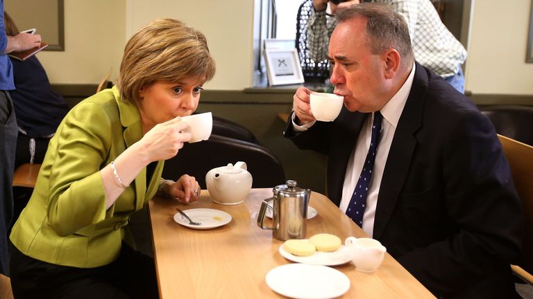 File photo dated 18/04/15 of Nicola Sturgeon enjoys a cup of tea with Alex Salmond while on the General Election campaign trail in Inverurie in the Gordon constituency. The former Scotland first minister and current Alba Party leader has died aged 69. Issue date: Saturday October 12, 2024.