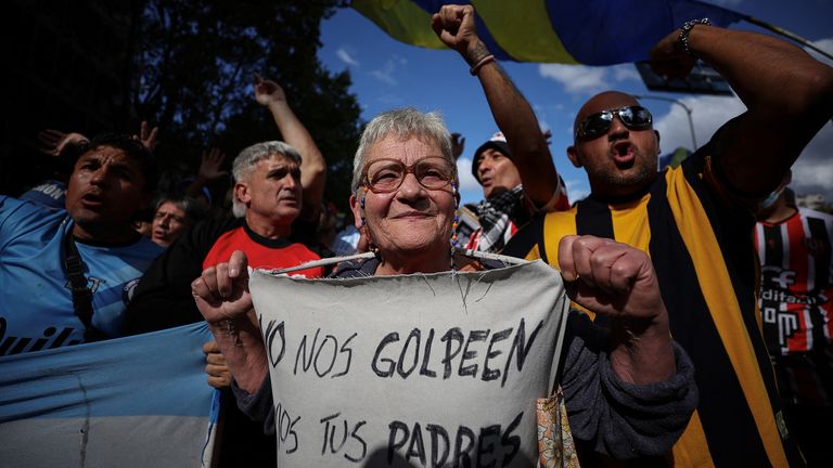 Football fans join the weekly protest of retirees against Argentinian President Javier Milei's policies in Buenos Aires. Pic: Reuters