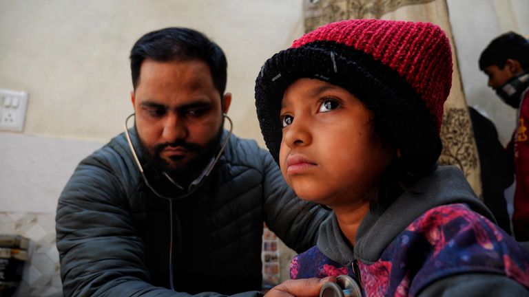 Dr Arshad Khan, who has been practicing near the garbage mountain for 14 years