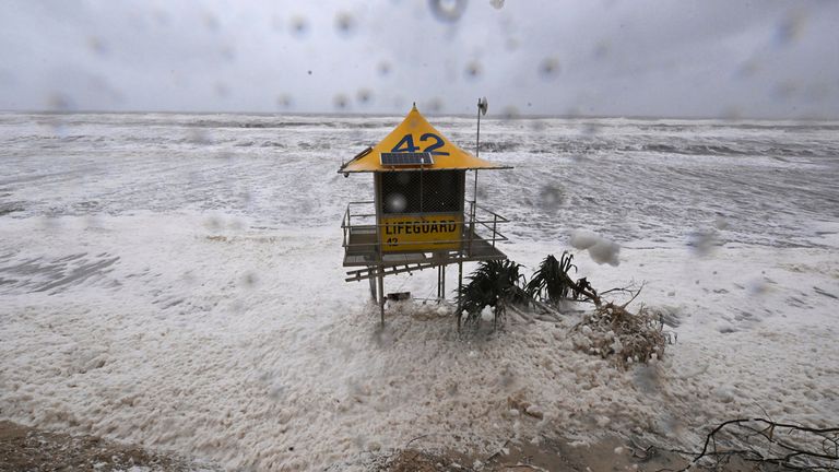 A lifeguard tower is surrounded by heavy seas following Cyclone Alfred on the Gold Coast, Australia, Saturday, March 8, 2025. (Dave Hunt/AAP Image via AP)