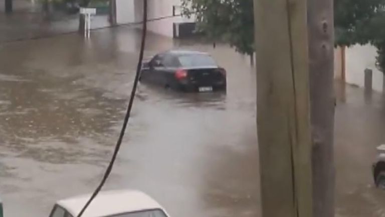 Cars seen in floodwater in Bahia Blanca, Argentina. Pic: Pic: maxiromeromn