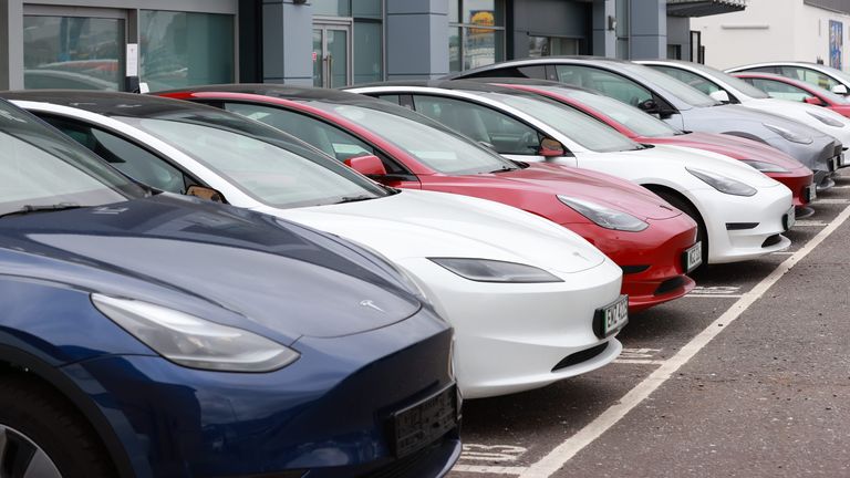 Cars on the forecourt of the Tesla dealership on the Boucher Road in Belfast. Police in south Belfast are appealing for information after a report was received on Sunday that damage had been caused to a large number of vehicles at commercial premises in the Boucher Road area. Picture date: Monday March 17, 2025.

