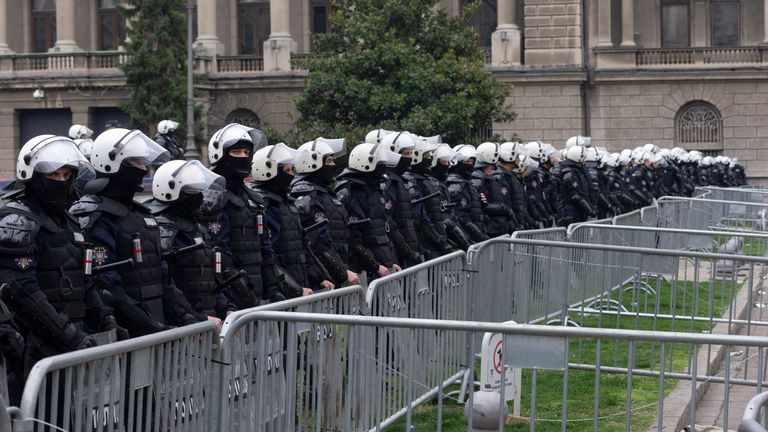 Riot police protect the office of the president. Pic: PA