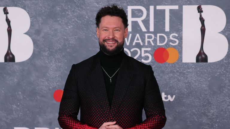 Calum Scott in black and red, plus a turtle neck for good measure. 