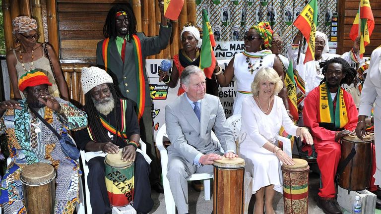 Lying photo dated 12/3/2008 from Prince Charles and the Duchess of Cornwall Camilla plays with a Rasta orchestra in the home of the late reggae singer Bob Marley, who is now the Bob Marley Museum in Kingston, Jamaica. Arthur Edwards/The Sun/PA ​​Wire