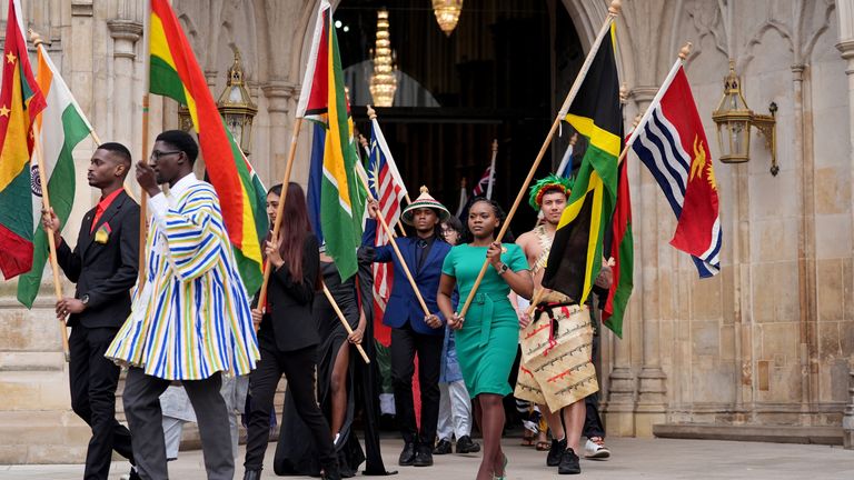 Flag bearers leave after attending the Commonwealth Day Service of Celebration. Pic: PA