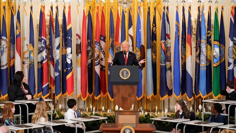 U.S. President Donald Trump speaks during an event to sign an executive order to shut down the Department of Education, in the East Room at the White House in Washington, D.C., U.S., March 20, 2025. REUTERS/Nathan Howard