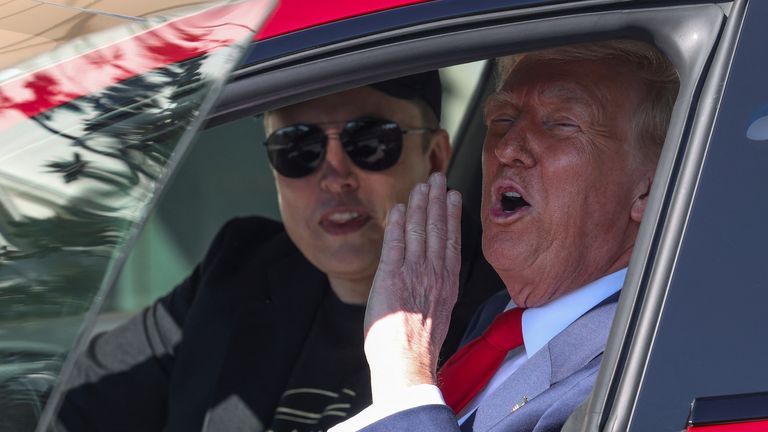 Donald Trump with Elon Musk in a Tesla after promising to buy one of the electric cars. Photo: Reuters