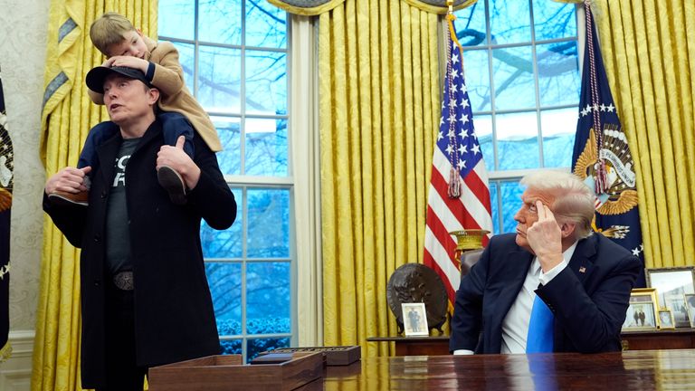 Elon Musk didn't wear a suit, but did wear a baseball hat during his recent visit to the Oval Office. Pic: AP