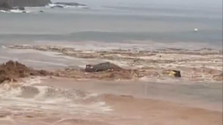 Car swept out to sea in Canary Islands flooding | World News | Sky News