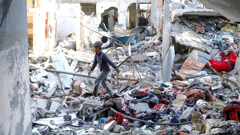 Palestinians inspect the site of an Israeli strike on a house, in Khan Younis in the southern Gaza Strip.  Pic: Reuters