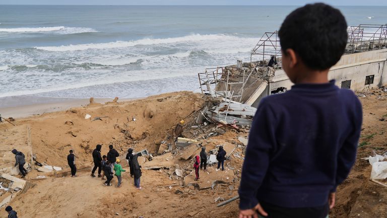 Palestinians inspect the rubble of a structure hit by an Israeli bombardment in Deir al-Balah, Gaza on Saturday. Pic: AP Photo/Abdel Kareem Hana