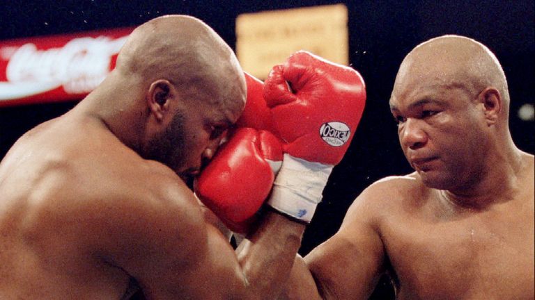 George Foreman (right) lands a punch on the nose of Michael Moorer during the fourth round of their heavyweight attack in November 1994. Pic: Reuters