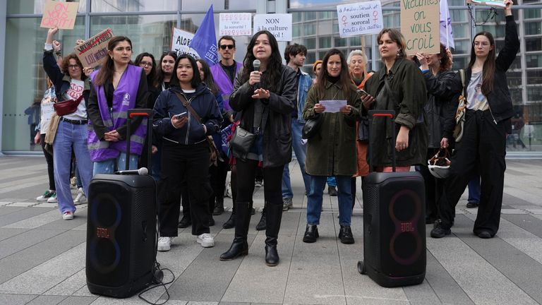 Women demonstrate outside the palace of justice where actor Gerard Depardieu faces trial for the alleged sexual assaults of two women on a film set in 2021, Monday, March 24, 2025 in Paris. (AP Photo/Aurelien Morissard)