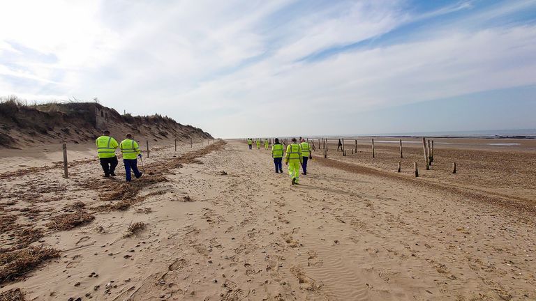 A clean-up team on Holme Beach in Norfolk. Pic: West Norfolk Council