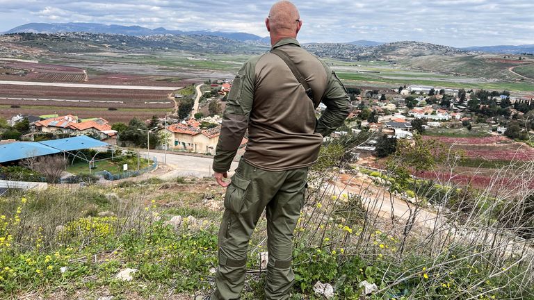 An Israeli soldier stands above the Israeli border village metula, only at the Israeli-Lebanon border on the Israeli side, near Metula, Israel on March 22, 2025.Reuters/Avi Ohayon