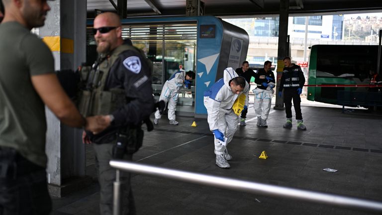 Israeli police work at the site where a suspected stabbing attack took place in Haifa, Israel.
Pic: Reuters