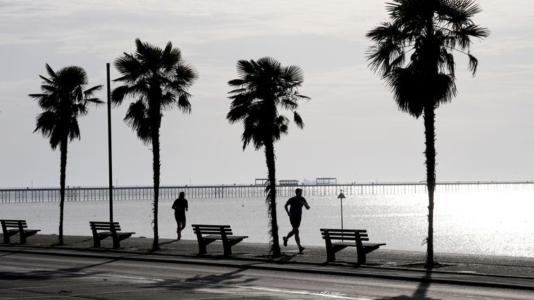 Joggers run along the sea front in Southend-on-Sea, Essex.
Pic: PA