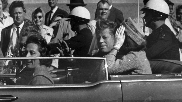 FILE - This Nov. 22, 1963 file photo shows President John F. Kennedy riding in motorcade with first lady Jacqueline Kenndy in Dallas, Texas. (AP Photo, file)