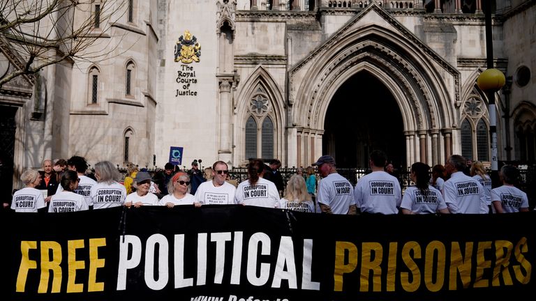 Just Stop Oil campaigners pose outside the Court of Appeal at the Royal Courts of Justice.
Pic: PA