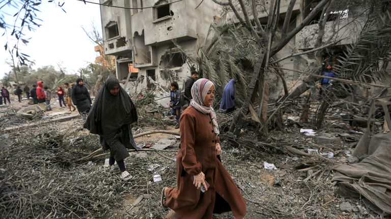 Palestinians inspect the site of an Israeli strike on a house, in Khan Younis in the southern Gaza Strip.
Pic: Reuters